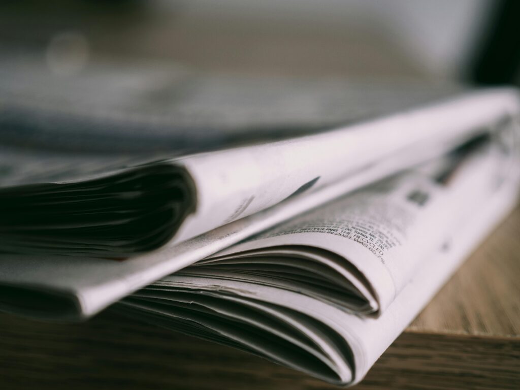 A closeup of a stack of newspapers